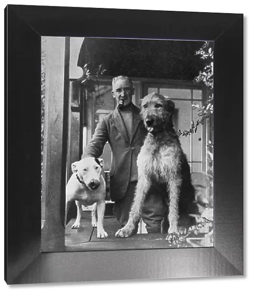 Cecil Aldin with two dogs