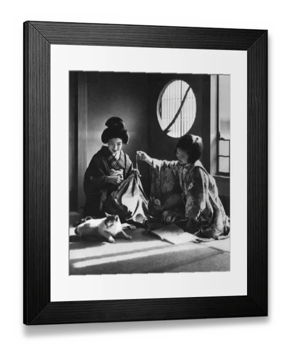 Framed Print : Japan - Woman and Young Girl Play with a Kitten Framed Print : Japan - Woman and Young Girl Play with a Kitten