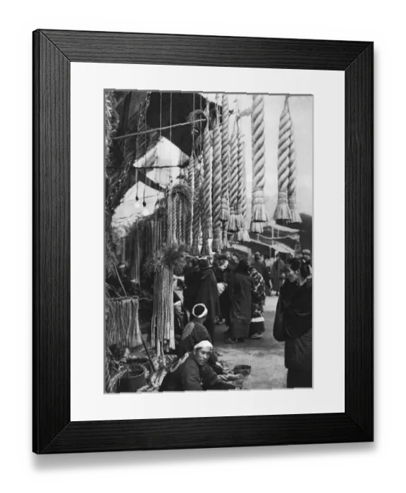Framed Print : A Japanese man sells straw ropes at a market Framed Print : A Japanese man sells straw ropes at a market