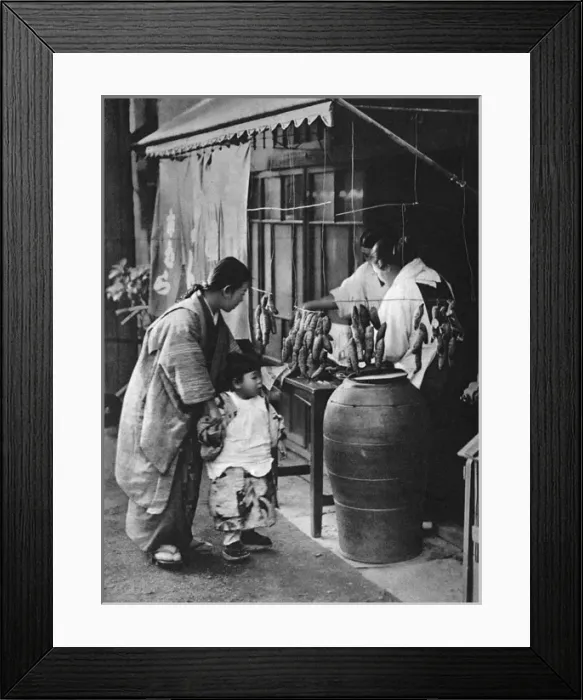 Framed Print : A Japanese mother and child look at a food stall Framed Print : A Japanese mother and child look at a food stall