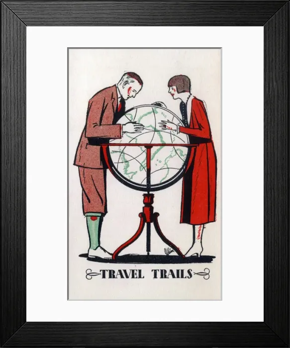 Framed Print : A couple plan their dream travel trip using a large globe Framed Print : A couple plan their dream travel trip using a large globe