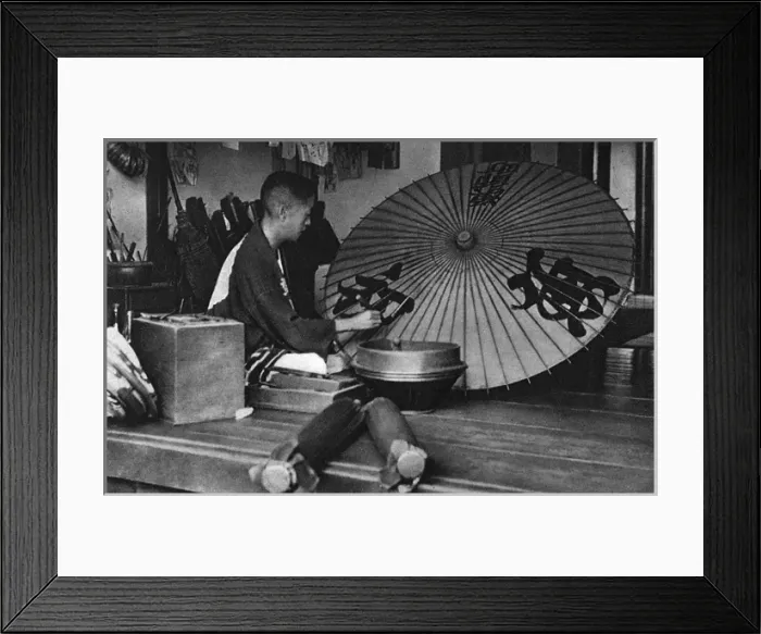 Framed Print : A Japanese man paints an umbrella Framed Print : A Japanese man paints an umbrella