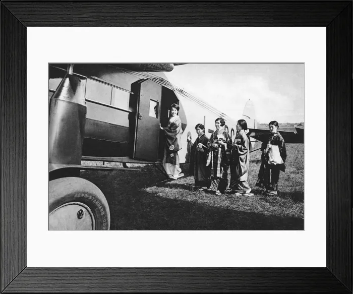 Framed Print : A group of Japanese women board an aircraft Framed Print : A group of Japanese women board an aircraft