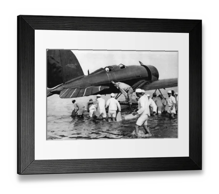 Framed Print : Col and Mrs. Lindbergh being aided with their aircraft Framed Print : Col and Mrs. Lindbergh being aided with their aircraft