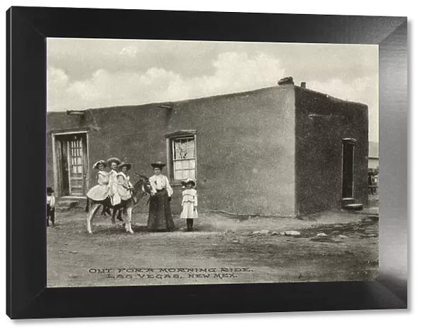 Three girls on a donkey, Las Vegas, New Mexico, USA