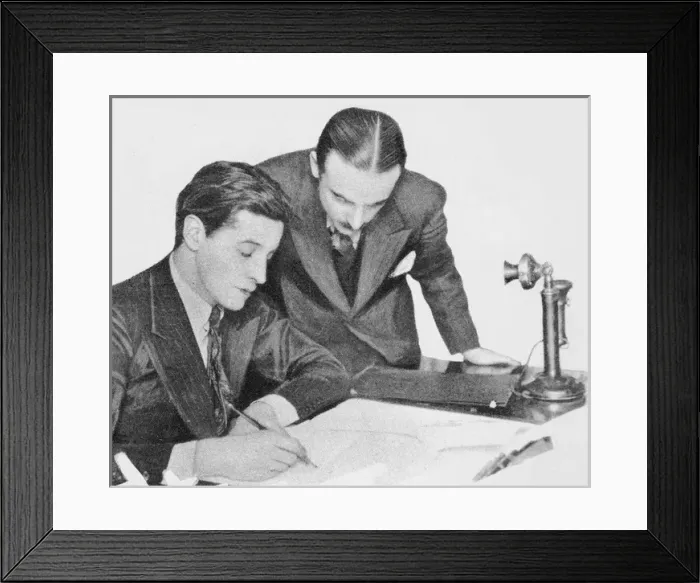 Framed Print : Ivor Novello & Michael Balcon signing a contract (1926) Framed Print : Ivor Novello & Michael Balcon signing a contract (1926)