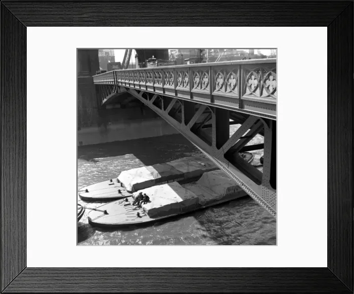 Framed Print : River barges and dockworkers towed under Tower Bridge, Londo Framed Print : River barges and dockworkers towed under Tower Bridge, Londo