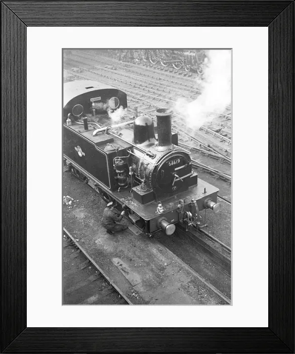 Framed Print : Railway engineer working on steam train, Liverpool Street St Framed Print : Railway engineer working on steam train, Liverpool Street St