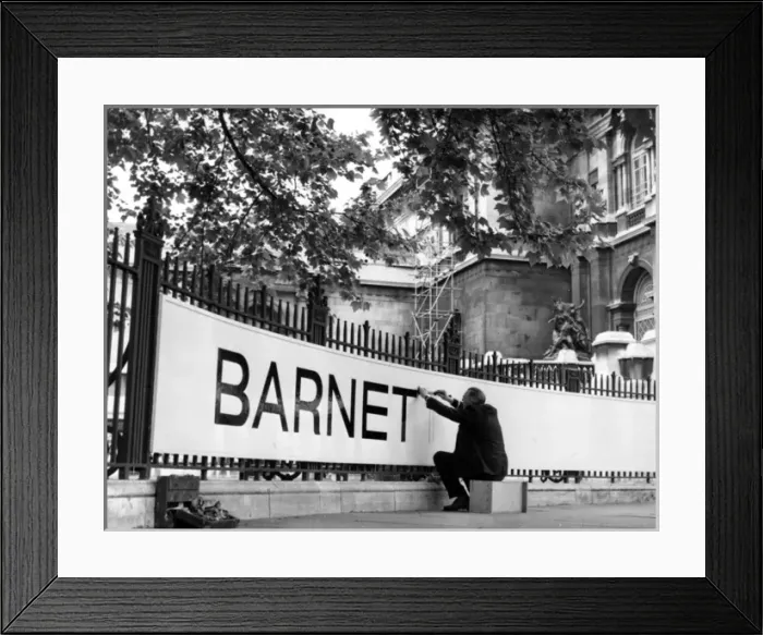 Framed Print : Signwriter painting a sign for exhibition Framed Print : Signwriter painting a sign for exhibition
