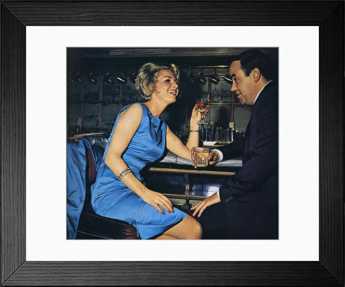 Framed Print : Escort sharing a drink with a client