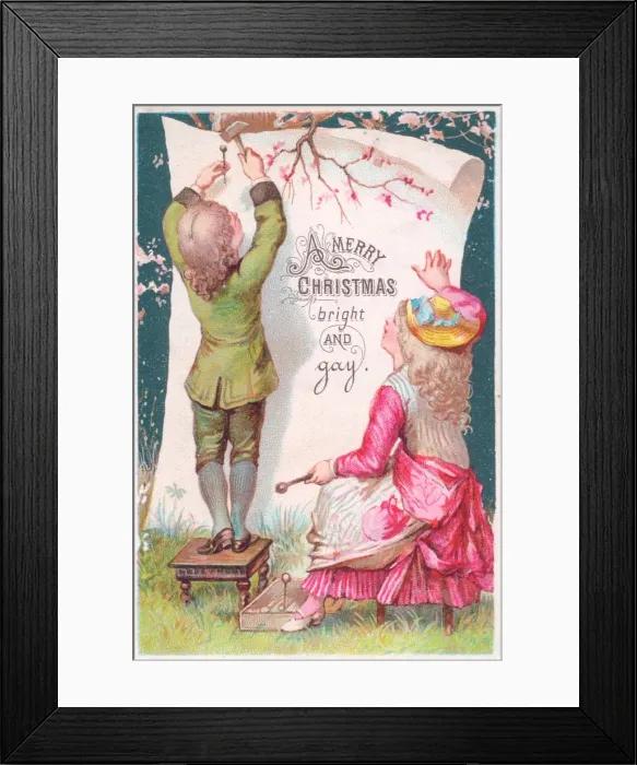 Framed Print : Boy and girl attaching Christmas greeting to a tree Framed Print : Boy and girl attaching Christmas greeting to a tree