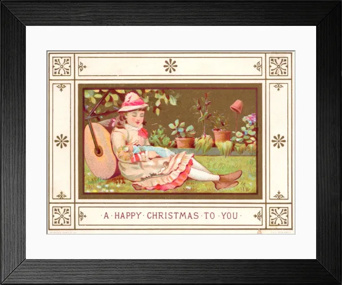 Framed Print : Girl in a garden with a doll on a Christmas card Framed Print : Girl in a garden with a doll on a Christmas card