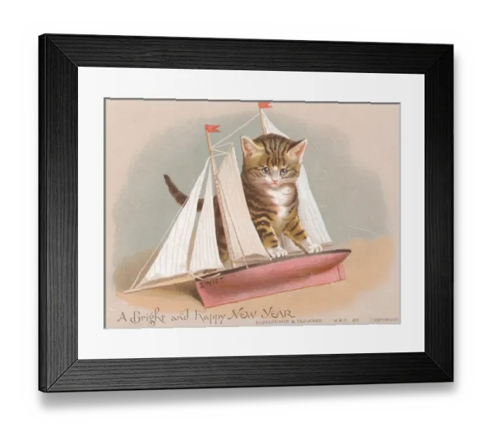 Framed Print : Kitten with toy sailing ship on a New Year card Framed Print : Kitten with toy sailing ship on a New Year card