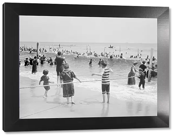 A group of children playing with rope on the beach, Atlantic