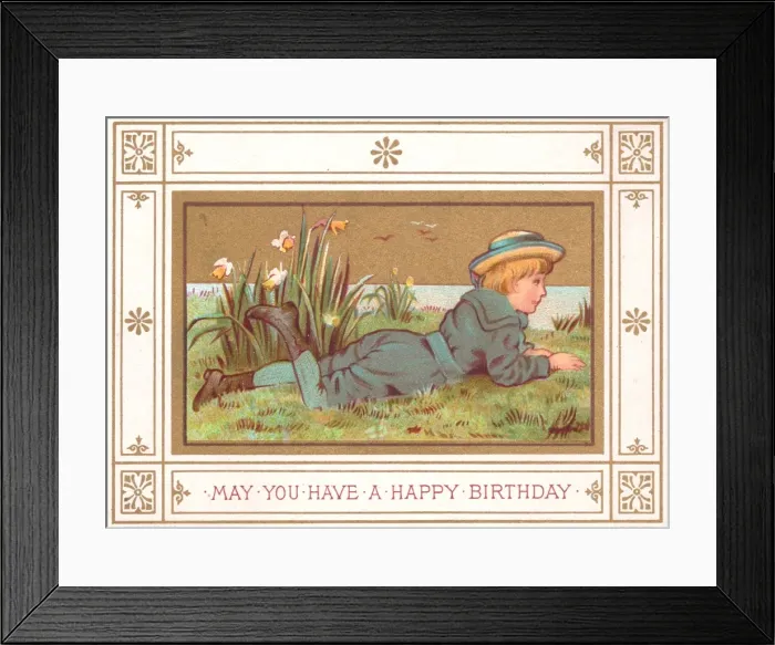 Framed Print : Boy lying on grass on a birthday card Framed Print : Boy lying on grass on a birthday card