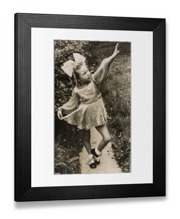 Framed Print : Little girl in costume, posing on a garden path Framed Print : Little girl in costume, posing on a garden path