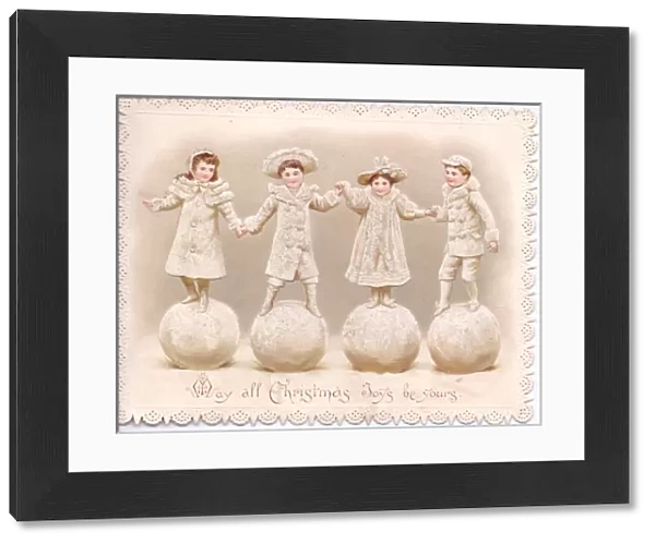 Four children stand on large snowballs on a Christmas card