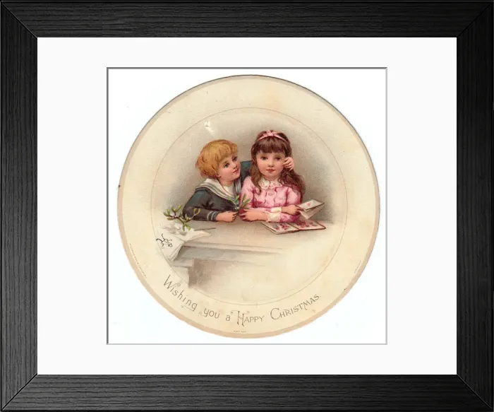 Framed Print : Boy and girl with mistletoe on a circular Christmas card Framed Print : Boy and girl with mistletoe on a circular Christmas card