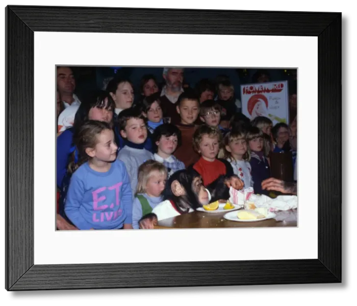 Framed Print : Children watching a chimps tea party Framed Print : Children watching a chimps tea party