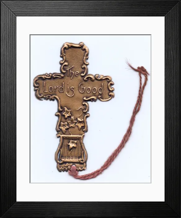Framed Print : Cross-shaped metal bookmark Framed Print : Cross-shaped metal bookmark