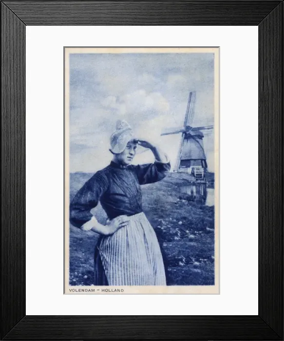 Framed Print : Woman and windmill, Volendam, Netherlands Framed Print : Woman and windmill, Volendam, Netherlands