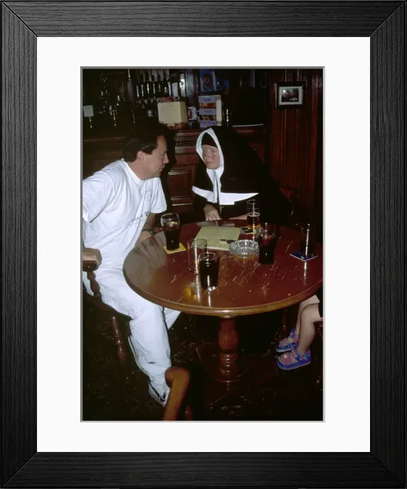 Framed Print : Nun with a man in a pub Framed Print : Nun with a man in a pub