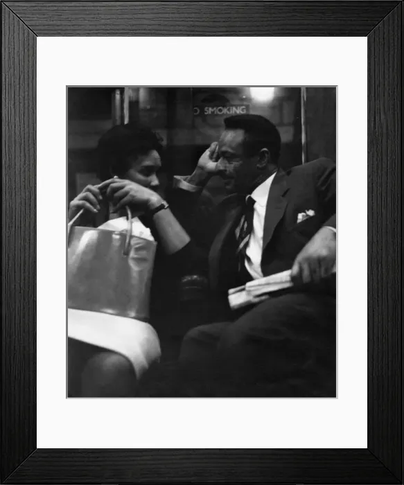 Framed Print : Couple on a London underground train Framed Print : Couple on a London underground train