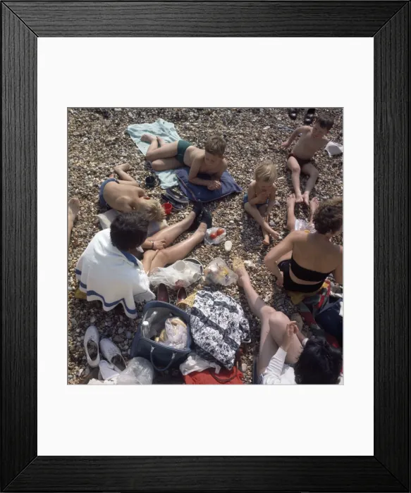 Framed Print : People having a picnic on a pebbly beach Framed Print : People having a picnic on a pebbly beach
