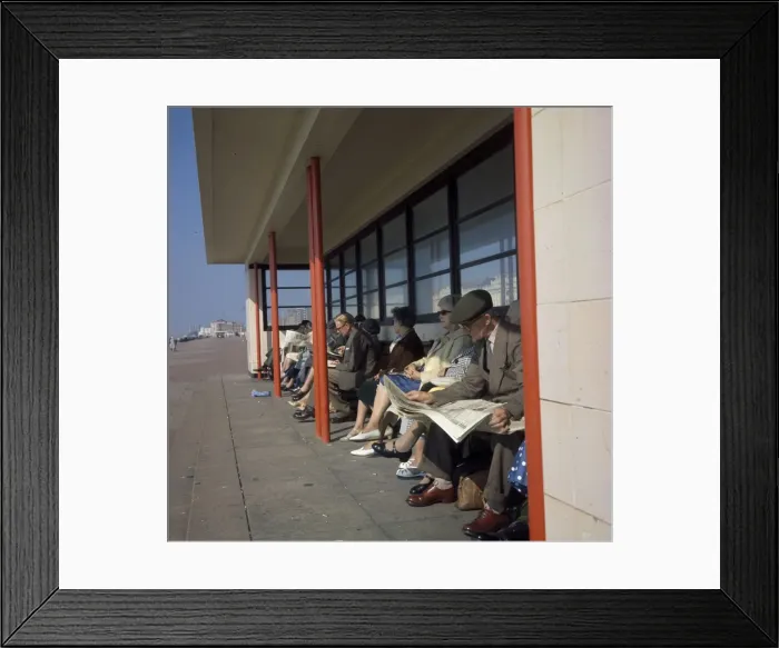 Framed Print : Middle-aged people in a beach shelter at the seaside Framed Print : Middle-aged people in a beach shelter at the seaside