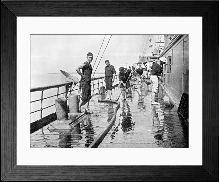 Framed Print : Sailor washing down decks on the U. S. S. Yankee