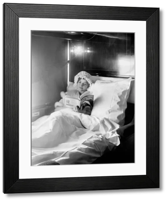 Framed Print : Woman reading in an Electric-lighted sleeper berth Framed Print : Woman reading in an Electric-lighted sleeper berth