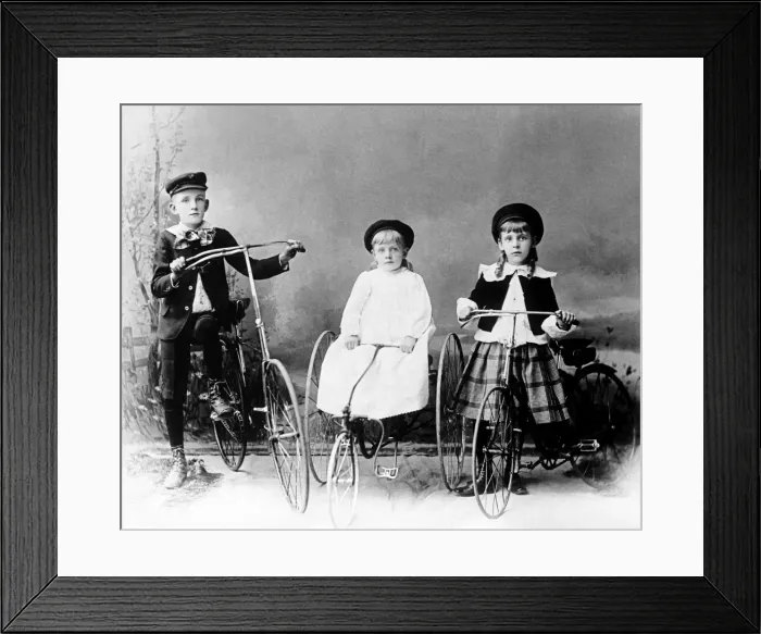Framed Print : Three children posed with bicycle and tricycles in America Framed Print : Three children posed with bicycle and tricycles in America