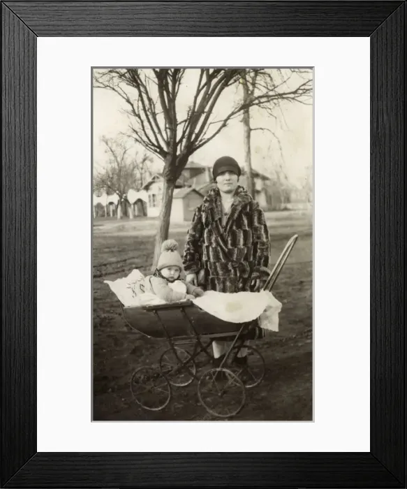 Framed Print : Young Mother and baby out for a winter walk in the park Framed Print : Young Mother and baby out for a winter walk in the park