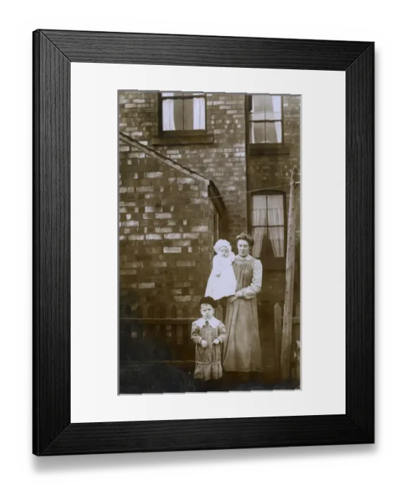Framed Print : Housewife in the backyard of her terraced home with children Framed Print : Housewife in the backyard of her terraced home with children