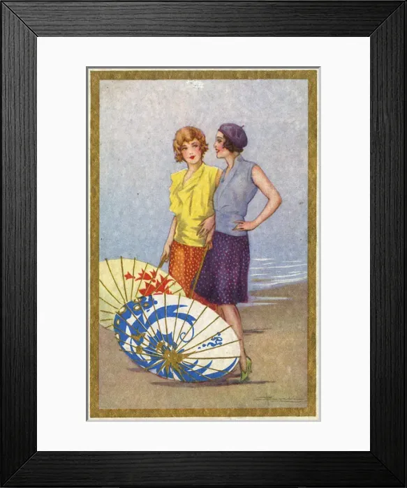 Framed Print : Two Stylish Belgian girls on the beach with Paper Umbrellas Framed Print : Two Stylish Belgian girls on the beach with Paper Umbrellas