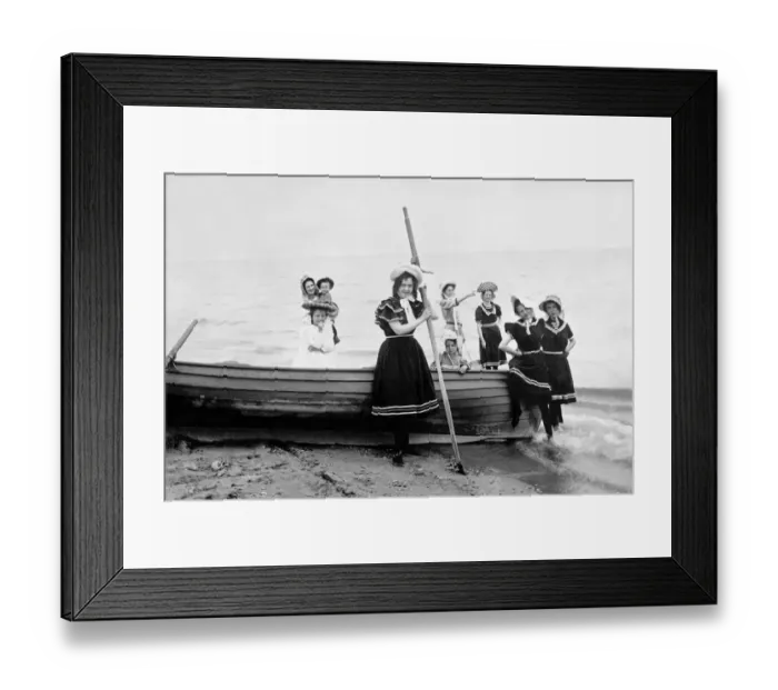Framed Print : Family with children in bathing suits on a boat on the beach Framed Print : Family with children in bathing suits on a boat on the beach
