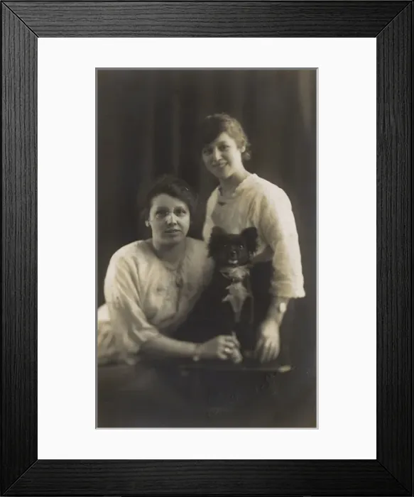 Framed Print : Studio portrait, two young women with dog Framed Print : Studio portrait, two young women with dog
