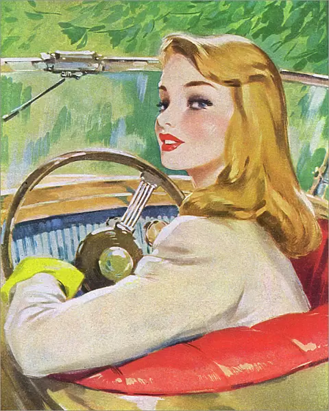 Young woman at the wheel of a car
