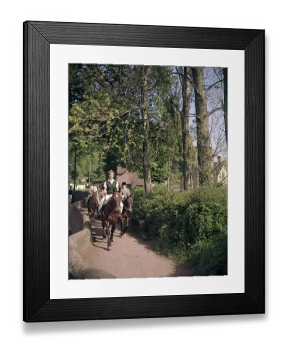 Framed Print : Women and children riding horses along a country lane Framed Print : Women and children riding horses along a country lane