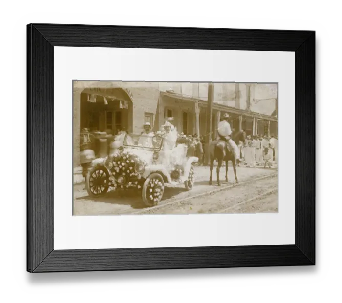 Framed Print : Men in flower-covered car in a parade, USA Framed Print : Men in flower-covered car in a parade, USA