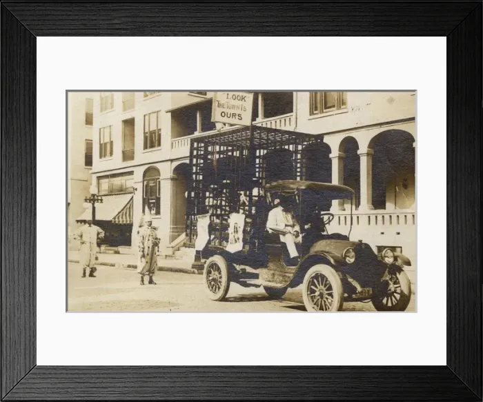 Framed Print : Studebaker flatbed truck with men in cage, USA Framed Print : Studebaker flatbed truck with men in cage, USA