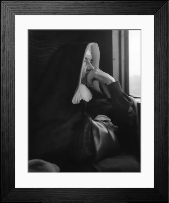 Framed Print : Nun sitting by a window Framed Print : Nun sitting by a window