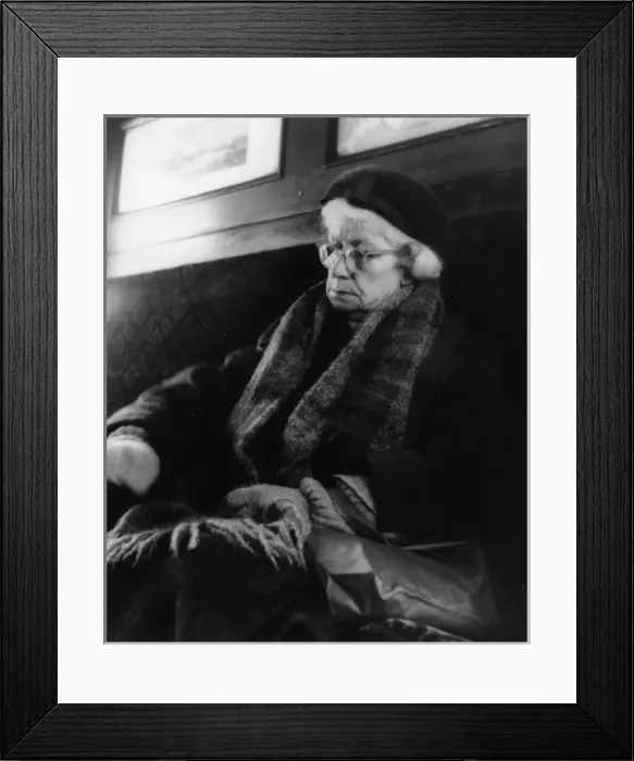 Framed Print : Tired elderly woman sleeping on a train Framed Print : Tired elderly woman sleeping on a train