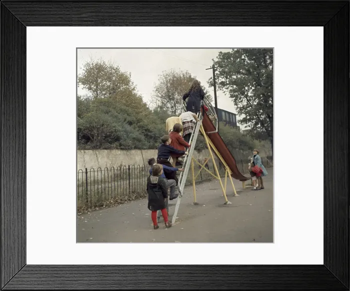 Framed Print : Children on a slide in a park Framed Print : Children on a slide in a park