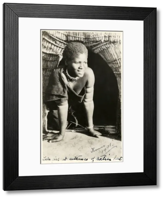 Framed Print : South Africa - smiling Zulu girl kneeling in her doorway Framed Print : South Africa - smiling Zulu girl kneeling in her doorway