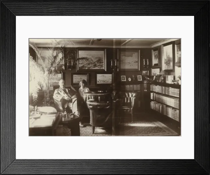 Framed Print : Well furnished room with man and young woman Framed Print : Well furnished room with man and young woman
