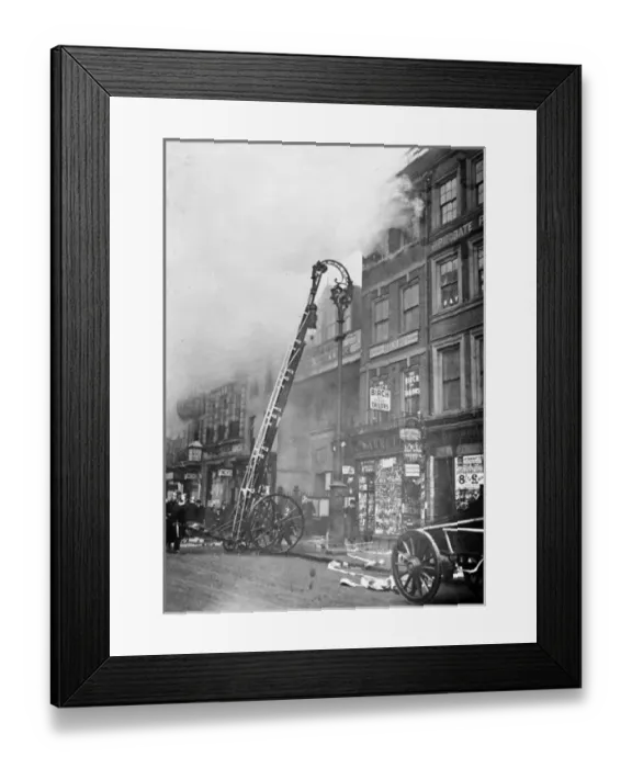 Framed Print : Firefighters attending a fire in the Strand in London Framed Print : Firefighters attending a fire in the Strand in London