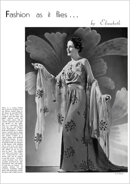 Model wearing a floral maternity evening gown 1937