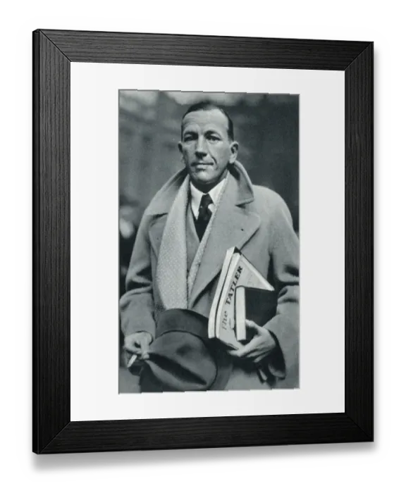 Framed Print : Noel Coward carrying The Tatler Framed Print : Noel Coward carrying The Tatler