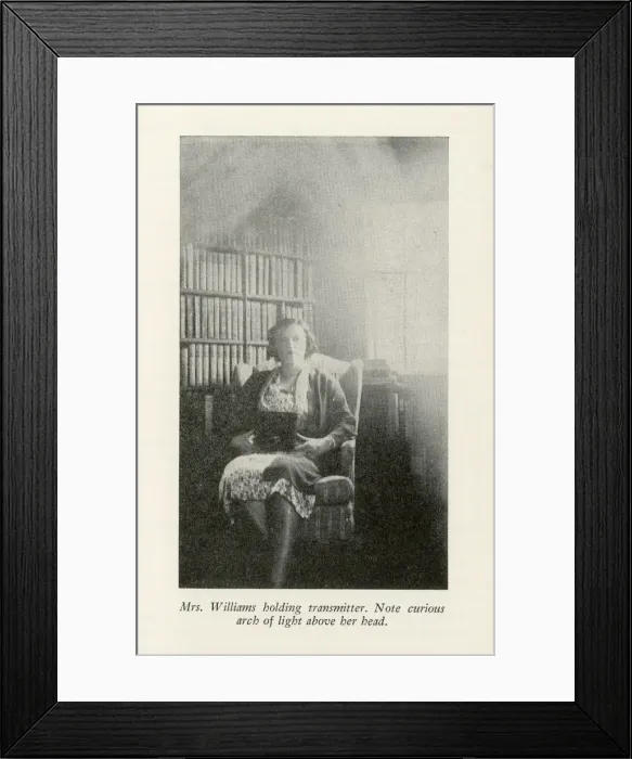 Framed Print : Mrs. William holding transmitter Framed Print : Mrs. William holding transmitter